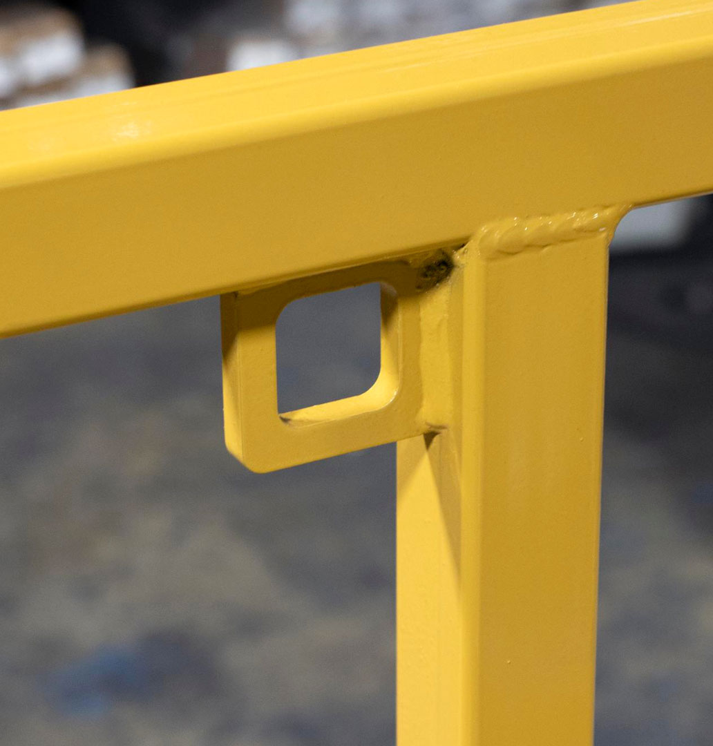 Platform railings and safety harness attachment points ensure worker safety