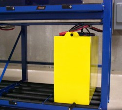 Lead-acid forklift battery on charging stand